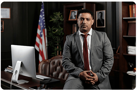 Professional man in suit using desktop.