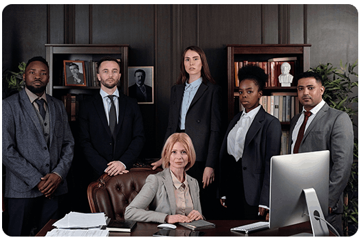 A group of business people posing for a photo.